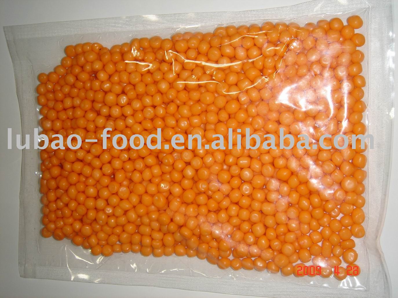 Hard candy coated with Orange flavor milk chocolate