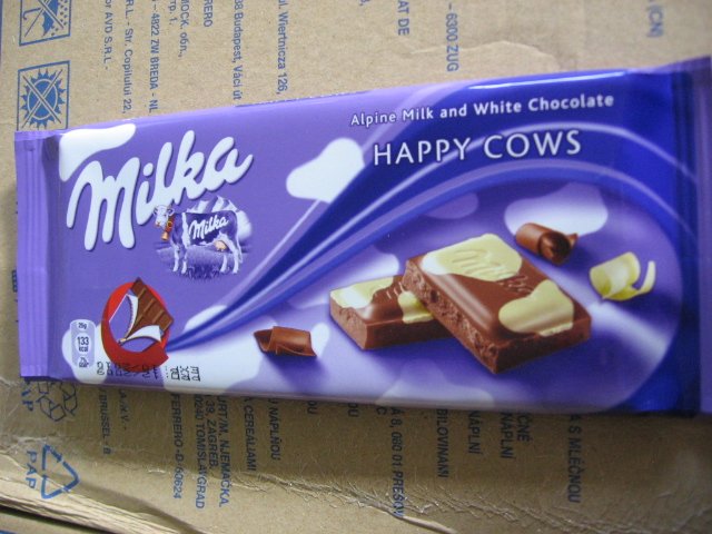 Milka Happy Cows Alpine milk and white chocolate product of Kraft Foods