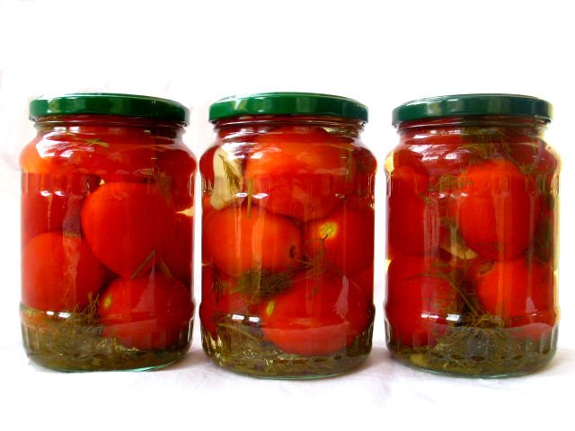 Big tomato in glass jar