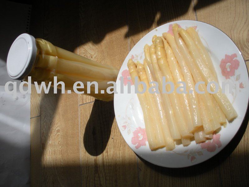 Canned white asparagus spears in glass jar