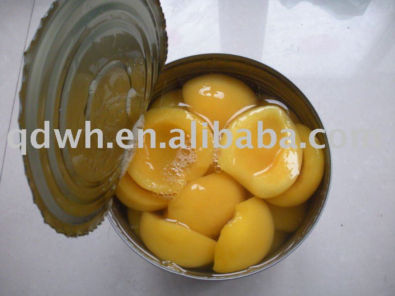Yellow peach halves in tins