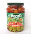 Mixed baby cucumber with tomatoes in glass jar