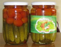 Pickled cherry tomato and baby cucumber in jar