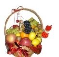 A decorated fruit basket, apples