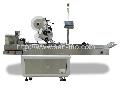 Top plane labeling machine