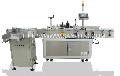Wrap around labeling machine