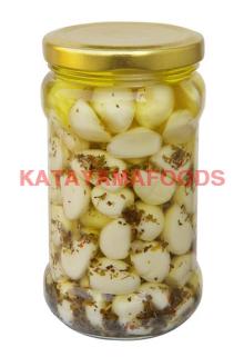 pickled garlic in brine with herbs