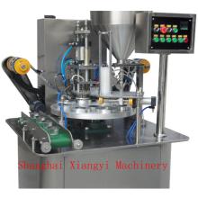 Turnable filling and sealing machine