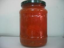 Peeled tomato in tomato juice