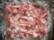 Frozen pork femur bones