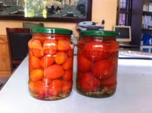Pickled big tomato in glass jar