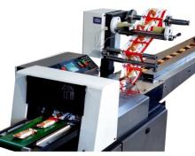 Horizontal flow packing machine