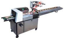 Reciprocating pillow packing machine