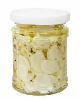 garlic slice in oil with herbs